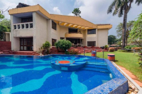 StayVista's Shantam House - Dive into relaxation with a pool and tennis lawn